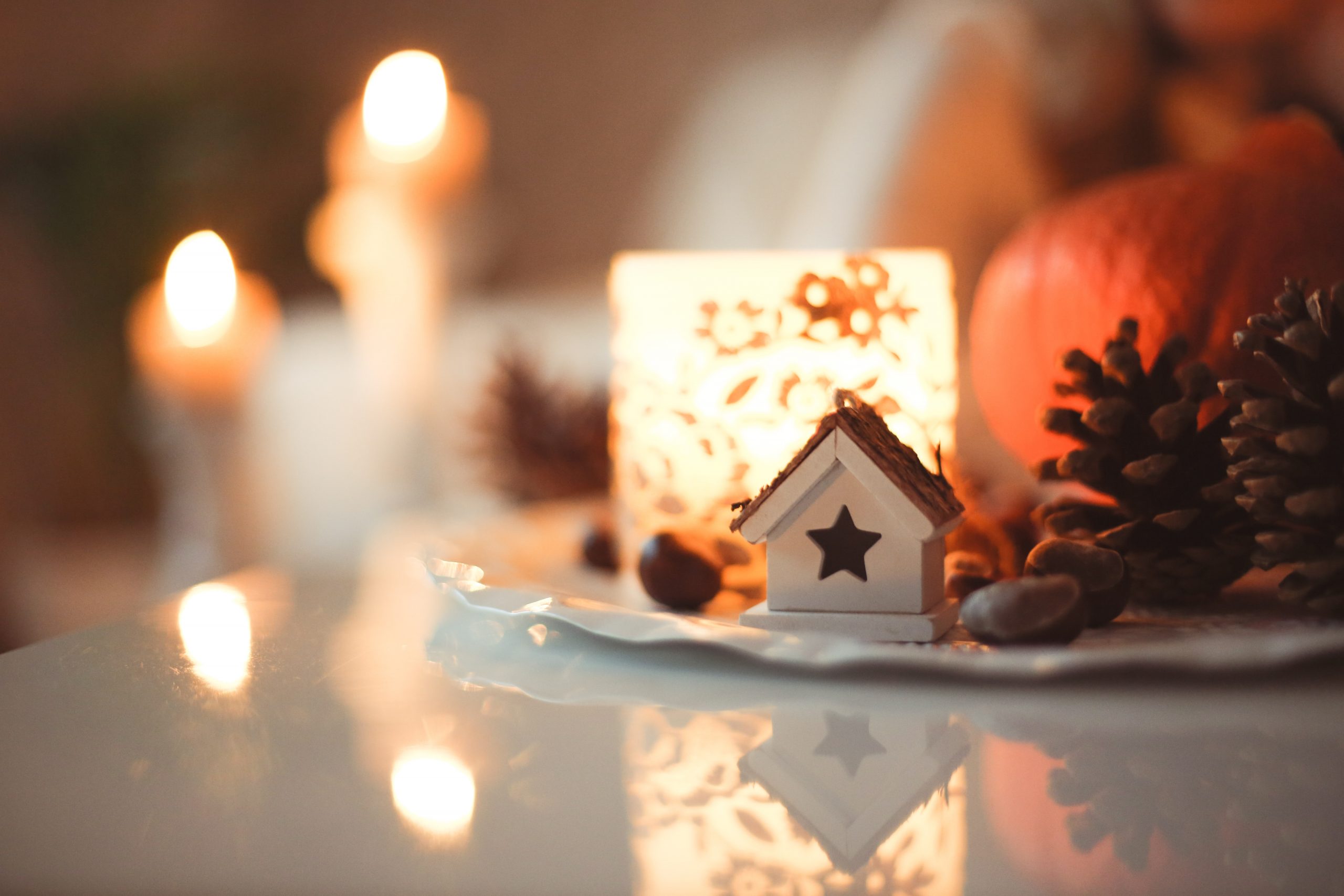 Scene of small Christmas house with candles